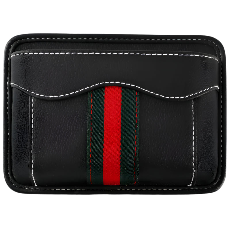 Black nylon car organizer box bag on an air vent, storing a phone and cards in a vehicle interior.